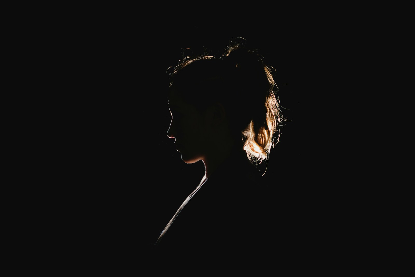 Photo by Molly Blackbird a black silhouette of a woman